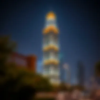 Daman Tower illuminated at night, symbolizing its significance in the urban environment