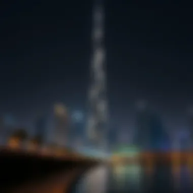 Night view of Creek Tower lit up, highlighting its modern aesthetic